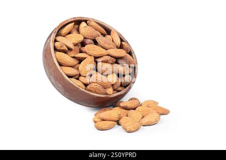 Delicious sweet almonds in wooden bowl isolated on white background, roasted almond nut, healthy food Stock Photo