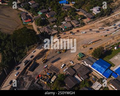 Aerial view of new road. Freeway under construction in mountainous area. Infrastructure at a motorway road construction site. Stock Photo