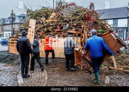 Building the traditional hogmanay bonfire in Biggar, South Lanarkshire, Scotland. Stock Photo