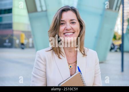 Smiling Businesswoman Holding Notebook Outdoors Stock Photo