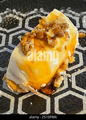 Cheese cake with honey and walnuts. Stock Photo