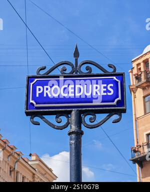 Procedures symbol. Concept word Procedures on beautiful blue road sign. Beautiful blue sky and city building background. Business procedures concept. Stock Photo