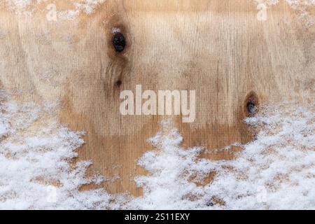 Wooden background covered with snow Stock Photo