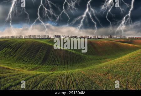 lightning over a hilly field. landscape with dramatic thunderclouds in the background. nature of Ukraine Stock Photo