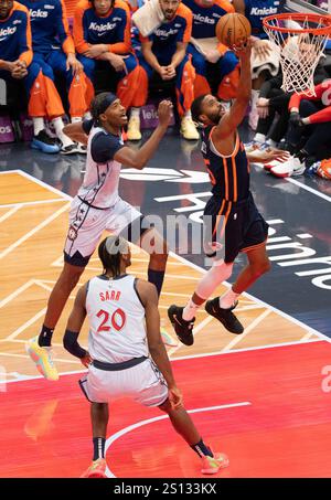 New York Knicks forward Mikal Bridges (25) and Jalen Brunson (11) walk ...