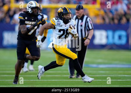 Reporters Run Iowa running back Kamari Moulton runs the ball against Washington ...