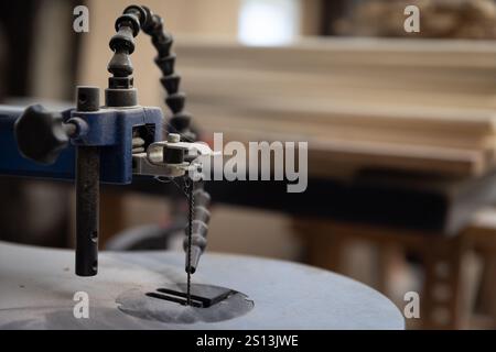 Details on a carpenter atelier working with different tools and machines. Stock Photo