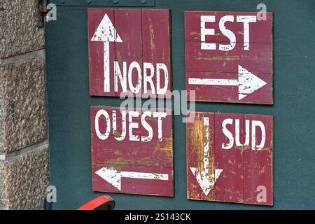 directions on a wooden board, France, Brittany Stock Photo