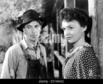 GARY COOPER and JOAN LESLIE in SERGEANT YORK 1941 director HOWARD HAWKS based upon the diary of Alvin C. York original screenplay Abem Finkel Harry Chandlee Howard Koch and John Huston music Max Steiner producer Jesse L. Lasky Warner Bros. Stock Photo