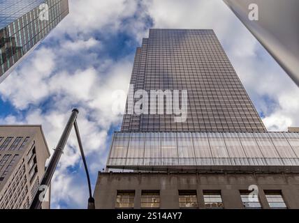 looking up at tall sleek office buildings in midtown manhattan Stock Photo