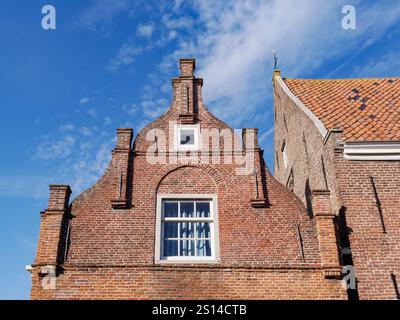 Old house with brick gable along Weezenland in old town of Monnickendam, Noord-Holland, Netherlands Stock Photo