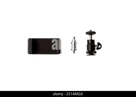 A smartphone holder with a tripod adapter and a ball head mount, useful for photography and videography setups, isolated on a white background. Stock Photo