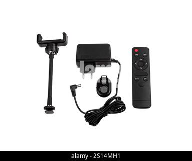 et of electronic accessories including a phone holder, power adapter, remote control, and wired remote shutter, useful for photography and videography Stock Photo