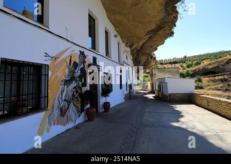 View of houses built into the rocks in Jaboneria street, Setenil de las Bodegas, Cadiz Province, Spain. Stock Photo