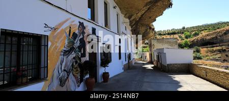 View of houses built into the rocks in Jaboneria street, Setenil de las Bodegas, Cadiz Province, Spain. Stock Photo