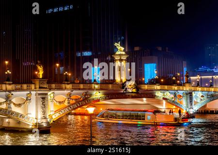 Colorful Tourist Boat Beian Bridge Large Office Buildings Night Illuminated Hai River Tianjin China. Built in 1939. Mix of Chinese and European Cultur Stock Photo