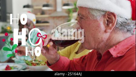 Image of christmas greetings text over senior diverse friends at christmas meal table Stock Photo