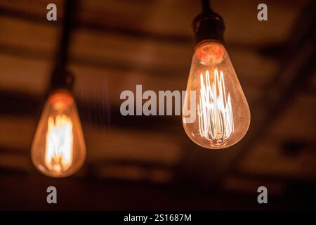 Two Hanging Edison light bulbs, also known as filament light bulb Stock Photo