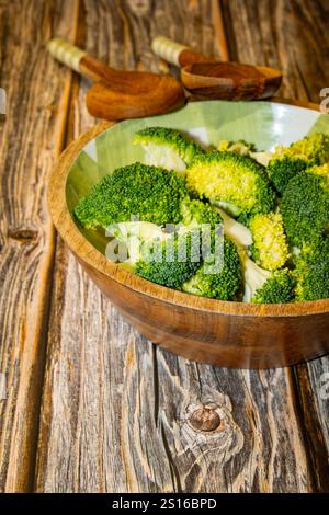 Fresh cut broccoli stalks on a green chopping board Stock Photo - Alamy