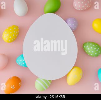 Spring pattern made of colorful Easter eggs on pastel pink background with paper card note copy space. Minimal Easter concept. Stock Photo