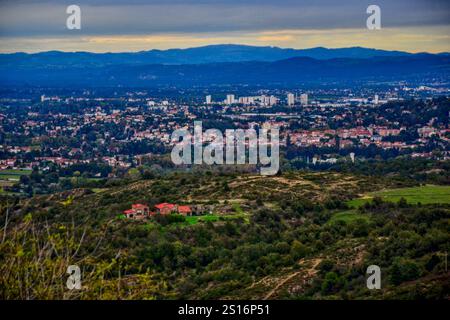 Chambles, France - October 5th 2024 : Aerial view of the city of Andrézieux-Bouthéon from the Essalois castle. Stock Photo