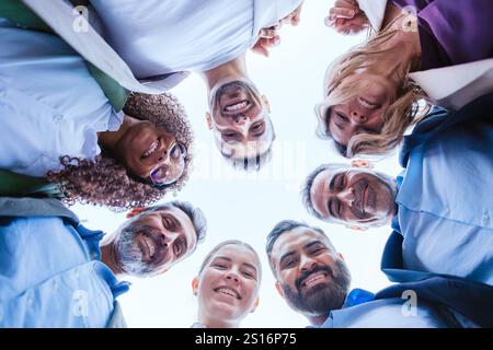Diverse Team Smiling in a Circle, Bottom View Stock Photo