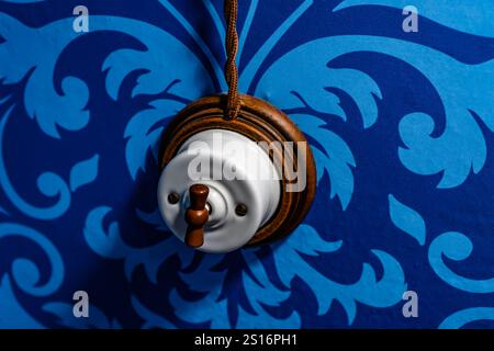 old switch lever on blue background Stock Photo