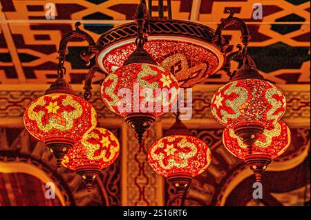 Old-fashioned decorative lamp hanging from the ceiling of a room. Stock Photo