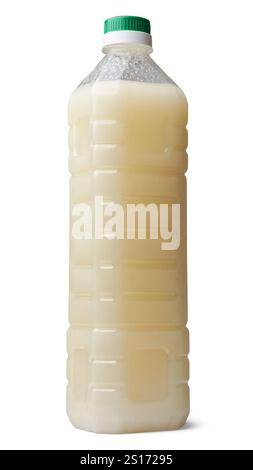 transparent plastic bottle of coconut oil with green cap isolated white background, mock-up template used for household cooking, skincare Stock Photo