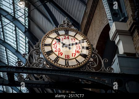 Kings Cross Station clock on platform 1. London Kings Cross Station Clock. London Kings Cross Platform One Clock. Stock Photo