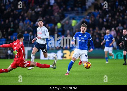 Cardiff City Stadium, Cardiff, UK. 1st Jan, 2025. EFL Championship Football, Cardiff City versus Coventry City; Cian Ashford of Cardiff City FC takes a shot on goal but Goalkeeper Oliver Dovin of Coventry City FC saves with his foot Credit: Action Plus Sports/Alamy Live News Stock Photo