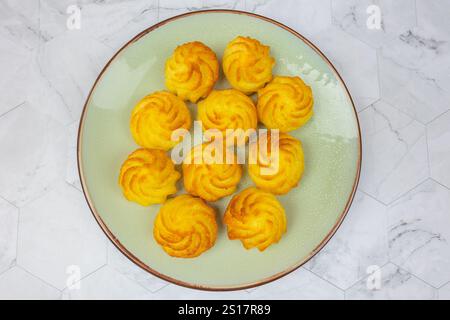 duchess potatoes on a plate Stock Photo