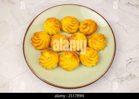 duchess potatoes on a plate Stock Photo