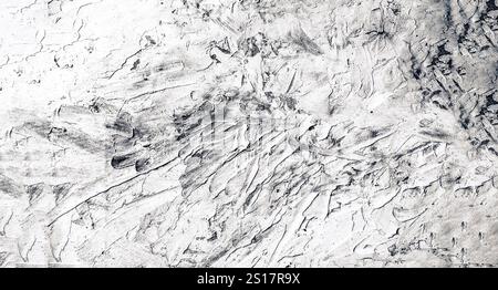 A white plaster wall provides a clean aesthetic to any space. Its smooth texture and neutral color make it a versatile backdrop for various decor styl Stock Photo