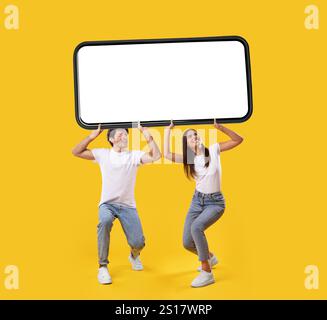 Couple holding heavy white empty smartphone screen Stock Photo
