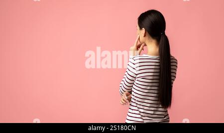 Back View Of Pensive Brunette Woman Looking At Copy Space With Interest Stock Photo