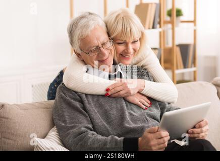Senior couple using digital tablet, having video call Stock Photo