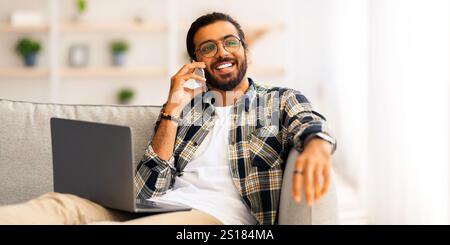 Joyful middle-eastern man freelancer working from home Stock Photo