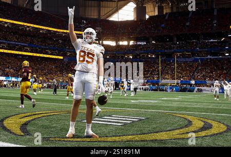 Atlanta, United States. 01st Jan, 2025. Texas tight end Gunnar Helm (85) celebrates after scoring the game-winning touchdown in the second overtime period against Arizona State in the Peach Bowl at Mercedes-Benz Stadium in Atlanta, Georgia on Wednesday, January 1, 2025. Texas defeated Arizona State 39-31 in two overtimes and advance to the College Football Playoff semi-finals. Photo by Mike Zarrilli/UPI Credit: UPI/Ģ����ý Live News Stock Photo