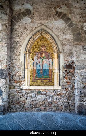 Painting of Mary and Child on stone wall in Taormina, Sicily, Italy Stock Photo