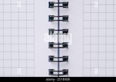 Top view of blank notebook page with black spiral and squares Stock Photo