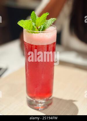 Refreshing and vibrant mocktail, the perfect blend of flavors for a cool, alcohol-free indulgence on the table. Stock Photo