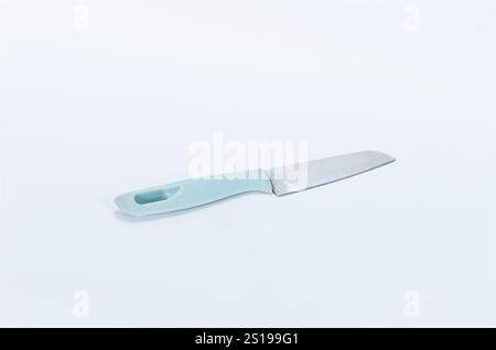 Minimalist Kitchen Knife with Light Blue Handle on White Background Stock Photo