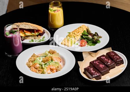 Indulge in a Variety of Delicious Assorted Dishes and Beverages Perfect for Food Lovers Everywhere Stock Photo