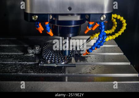 The 5-axis CNC milling machine cutting the automotive part with solid ball end mill tool. Stock Photo