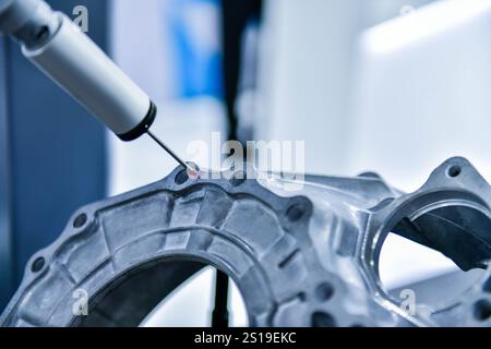 Close up automatic coordinate measurement machine (CMM) for inspection high precision engine block during working Stock Photo