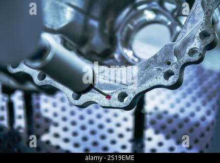 Close up automatic coordinate measurement machine (CMM) for inspection high precision engine block during working Stock Photo