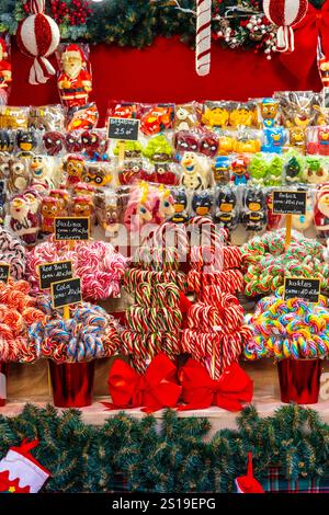 Stall with festive sweets and Christmas candy canes and lollipops at Warsaw Christmas Market, Warsaw, Poland Stock Photo