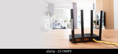 Black wifi router with four antennas. Fast wireless network concept Stock Photo
