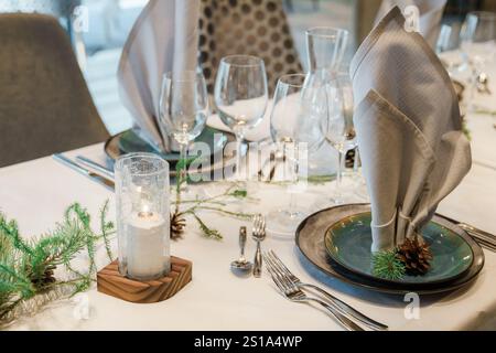decorated christmas table with gifts and candles in the room. Restaurant christmas decoration. party luxury Stock Photo